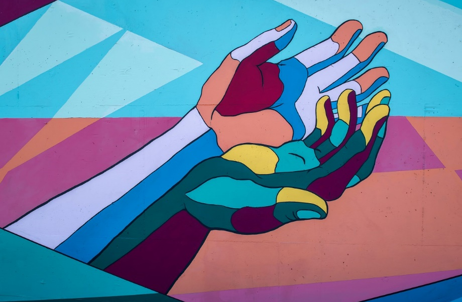 Hands open upwards with different colors 