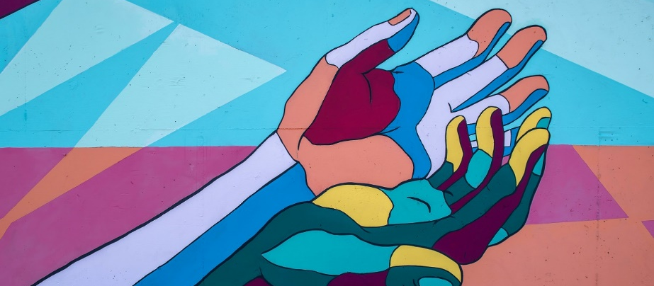 Hands open upwards with different colors