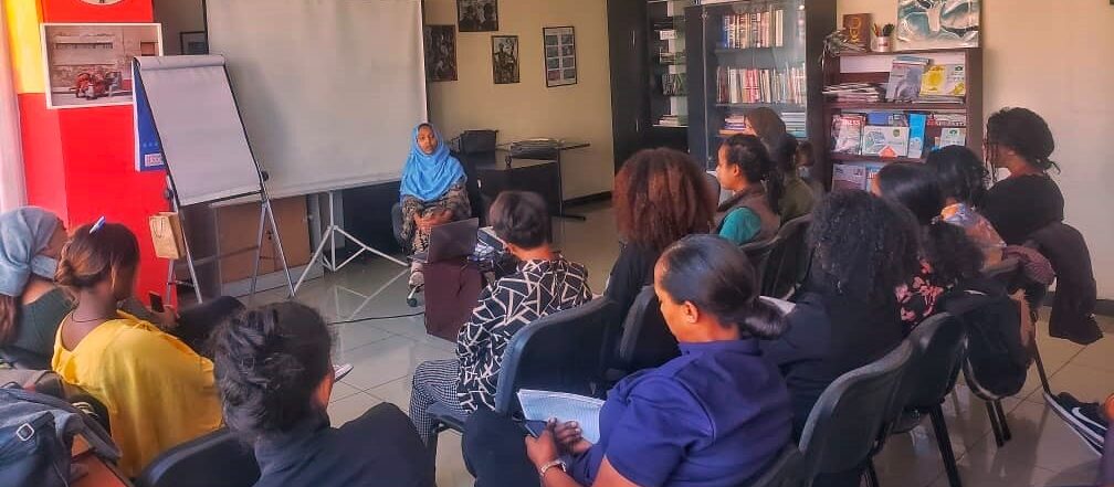 Nebat Abbas facilitating an AWiB session on Motivating Employees to Give Their Best to a group of women.